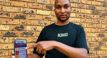 Black man pointing to a tablet