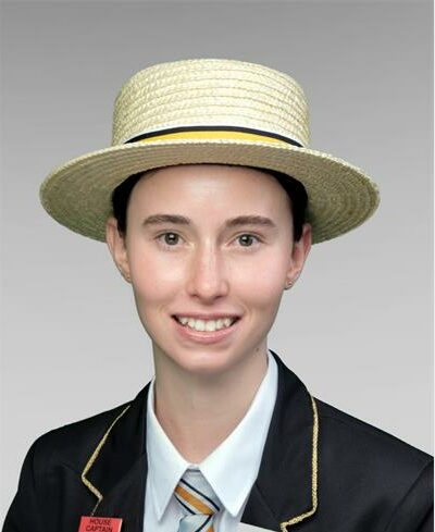 Girl wearing a hat and a school uniform