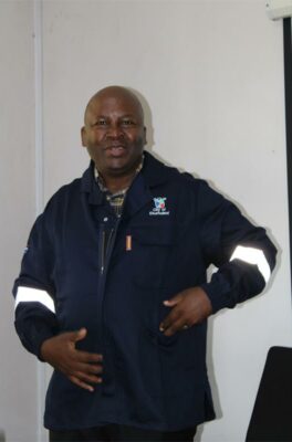 Black man wearing overalls