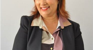 Coloured woman wearing a black jacket