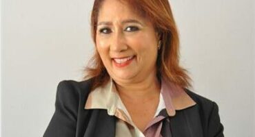 Coloured woman wearing a black jacket