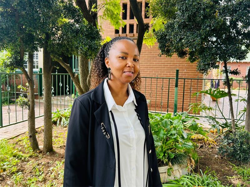 Black woman standing in a garden setting