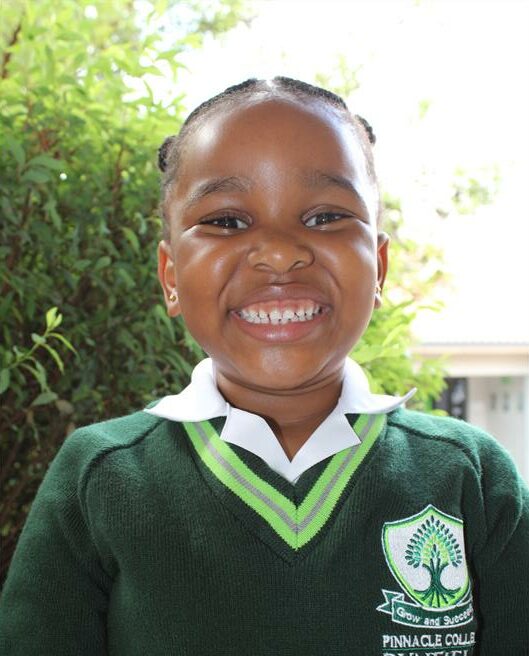 Black girl wearing a green jersey