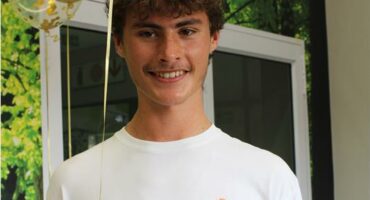 Young man stand in front of balloons