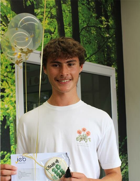 Young man stand in front of balloons