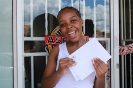 Girl holding an envelope