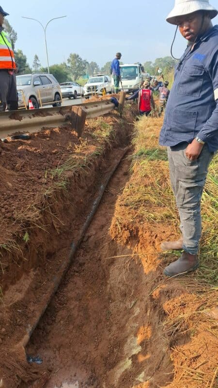 Man standing at a trench