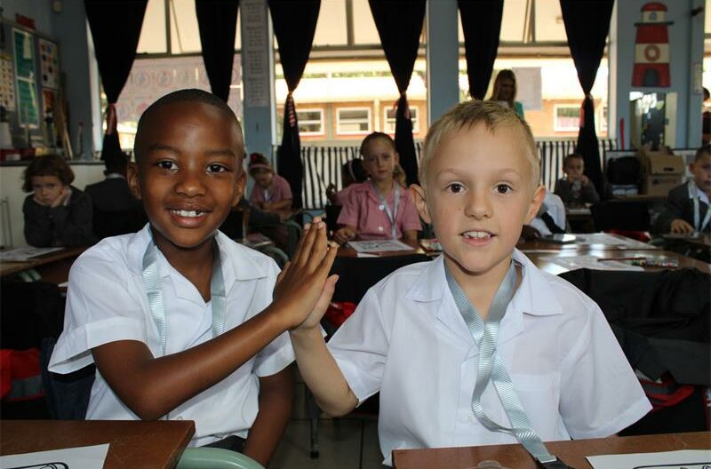 Two boys giving each other a high-five
