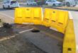 Yellow barriers placed around a hole