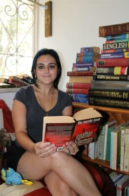 Girl sitting and reading a book