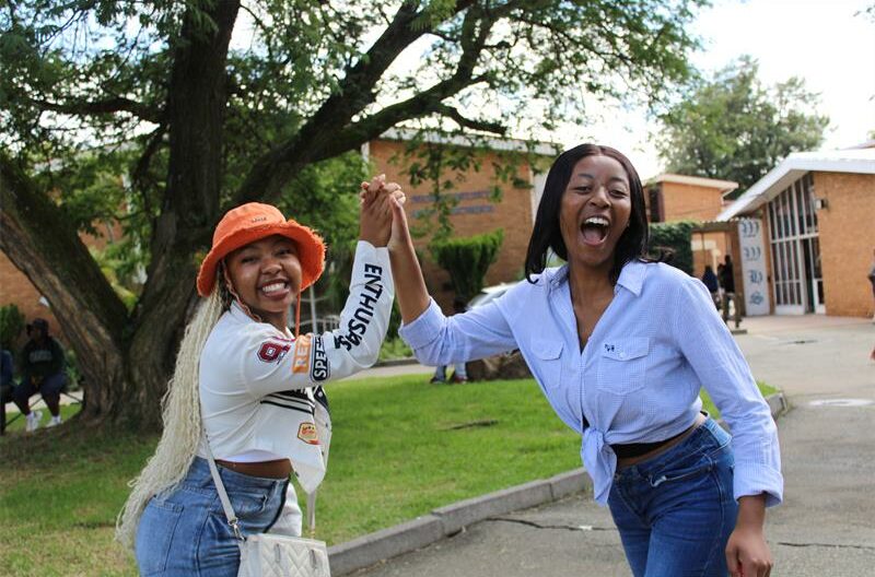 Two girls giving a hi-five