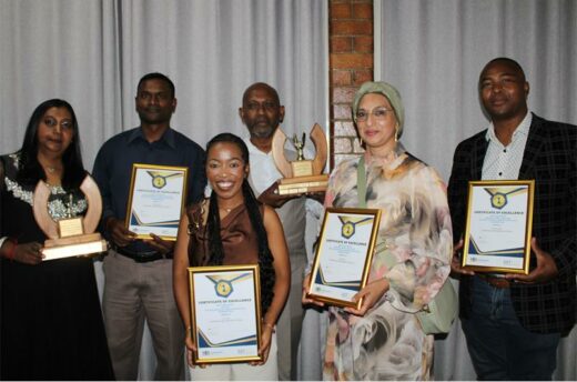 Group of six people holding certificates