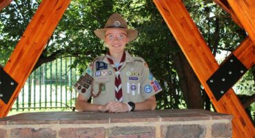 Girl with glasses and a hat