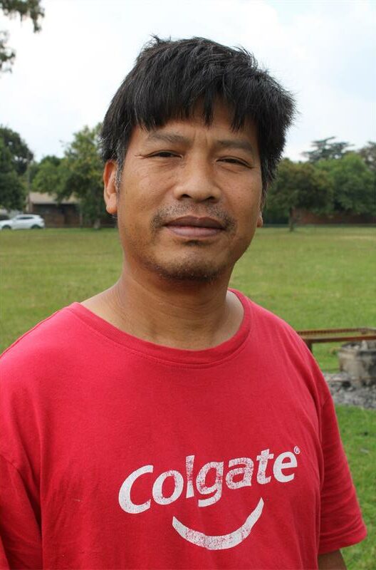 Asian man wearing red shirt
