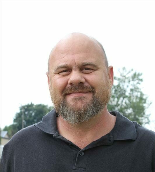Bald man wearing a black shirt