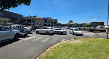Photo of different cars blocking the road