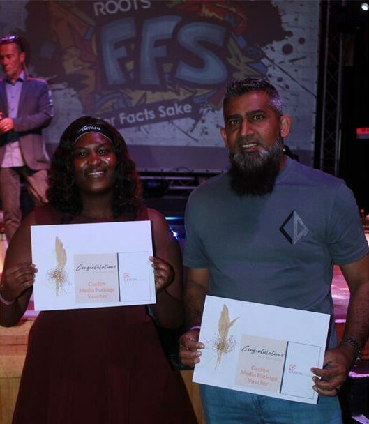Black woman and Indian man holding envelopes