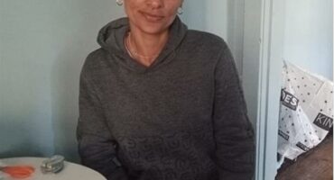 Indian woman sitting at a table