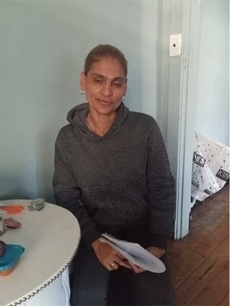 Indian woman sitting at a table