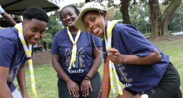 Three black kids smiling