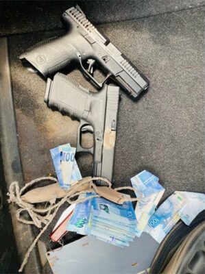 Two firearms and money