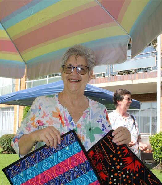 White woman holding placemats