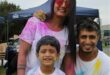 Indian family covered in paint powder