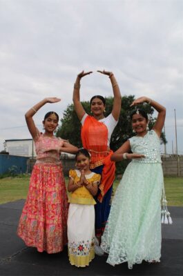 Four Indian girls wearing traditional Hindi outfits