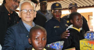 Minister Cachalia stands with police officers