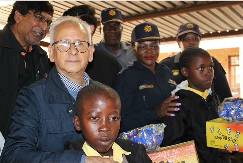 Minister Cachalia stands with police officers