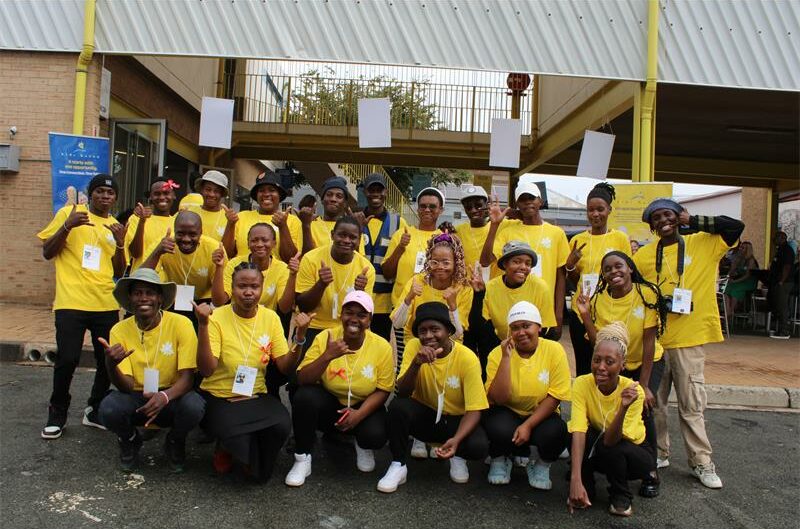 Group of youths wearing yellow T-shirts