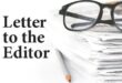 A black and white image depicting a stack of papers, reading glasses and a pencil next to the words Letter to the Editor.
