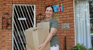 Woman holding a cardboard box