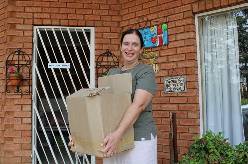 Woman holding a cardboard box