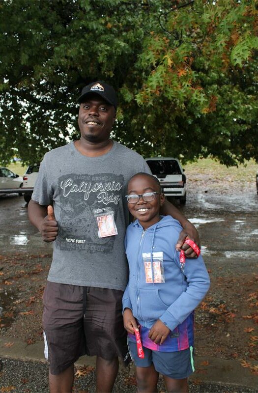 Black man with a young boy smiling