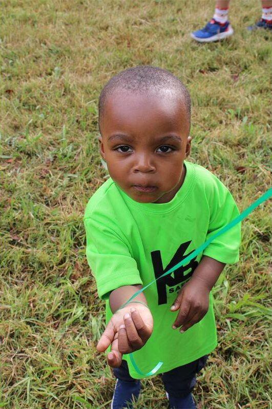 Black boy wearing green