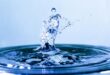 Drop of water splashing into a body of water