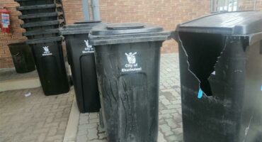 Photo of black wheelie bins
