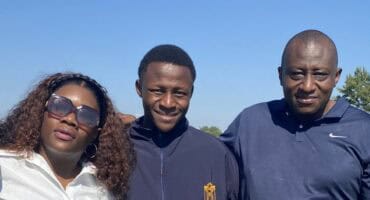 Three people huddled together