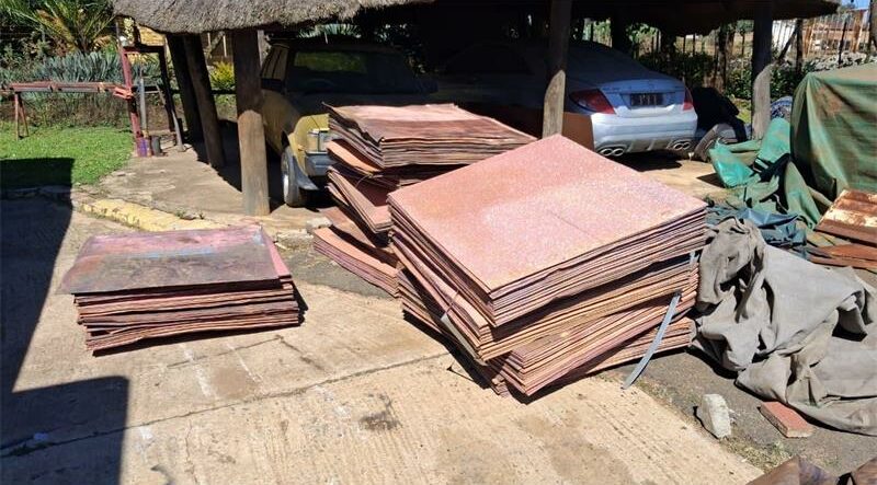 Copper plates stacked in a garden