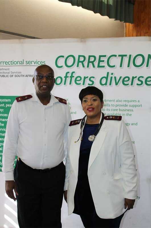 Black murse and black nurse dressed in white uniforms