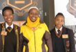 Three female learners in uniform