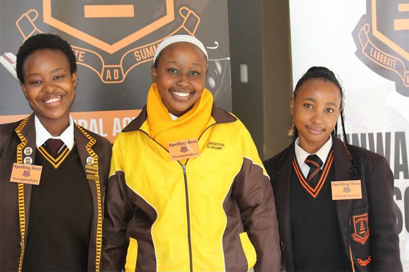 Three female learners in uniform