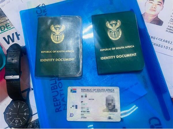 South African Smart ID and two green bar-coded IDs