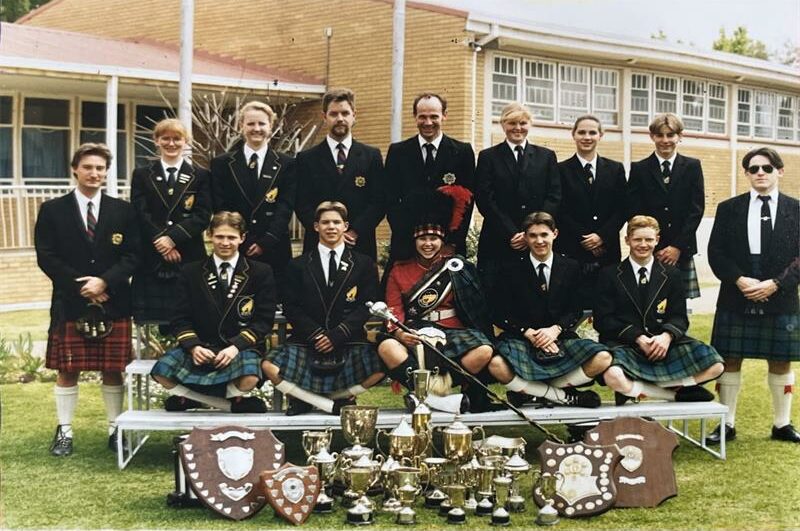 Grainy photo of a group of youths wearing kilts