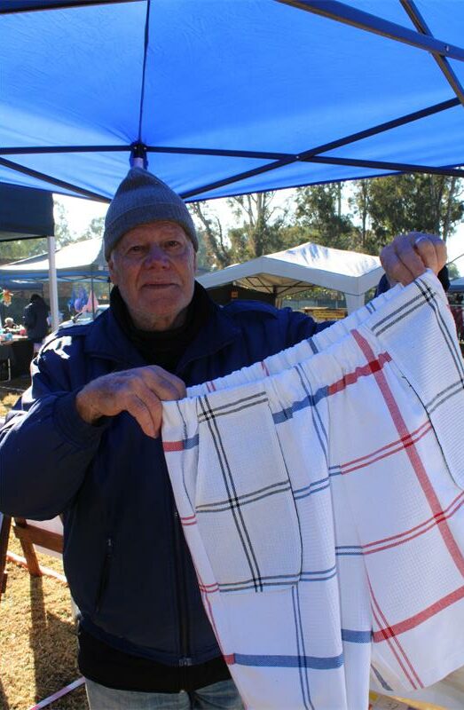 Man holding pants made from dish towels