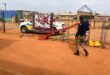 Uniformed officer walking next to playground equipment