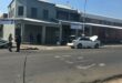 Accident scene in front of an old grey building