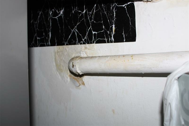 PVC with water leak marks against the wall