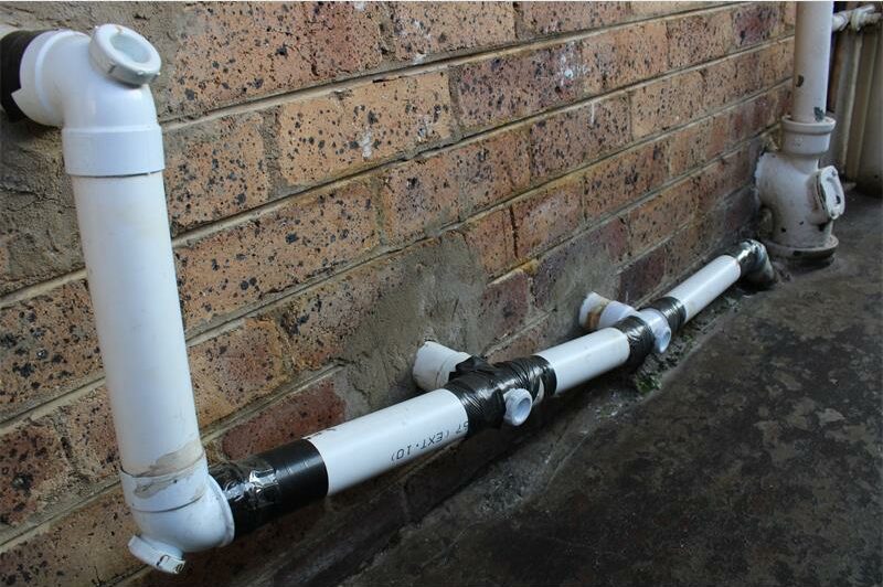 PVC pipes held together by black tape